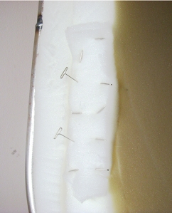 Use upholsterers T-pins to fix accidents while cutting.